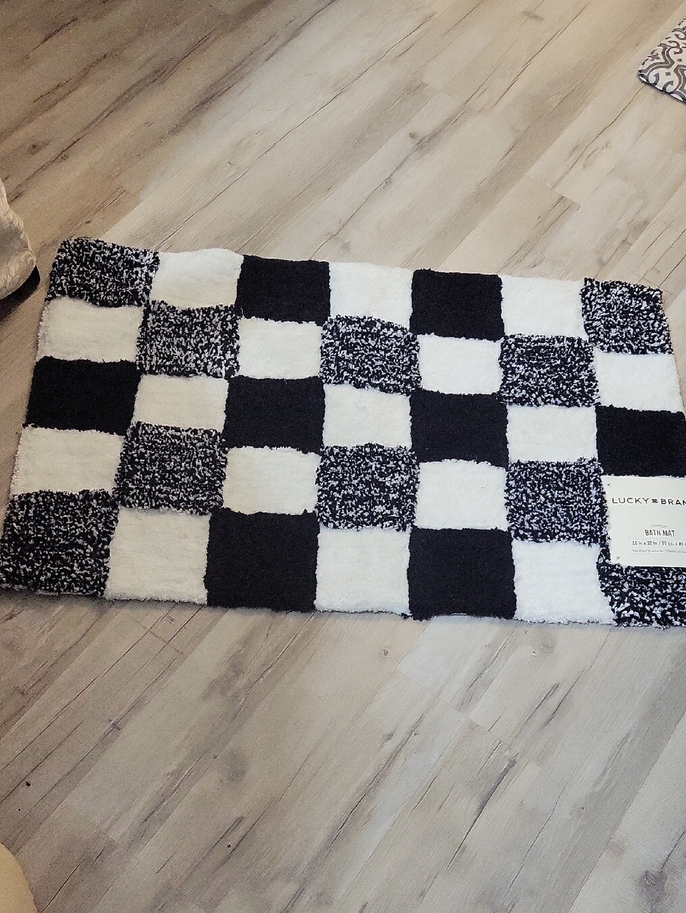 Lucky Brand checkered cotton bath mat in black and white.